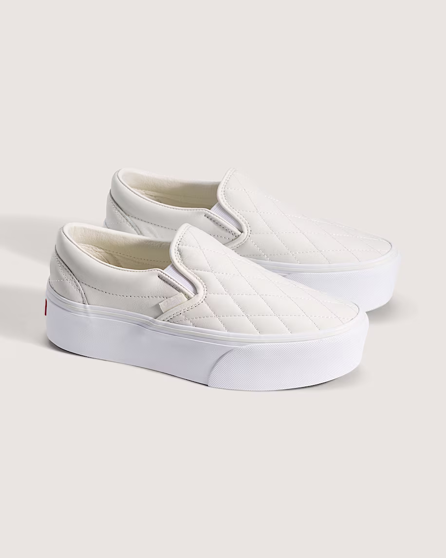 Woman styling Adidas Samba OG sneakers with trench coat